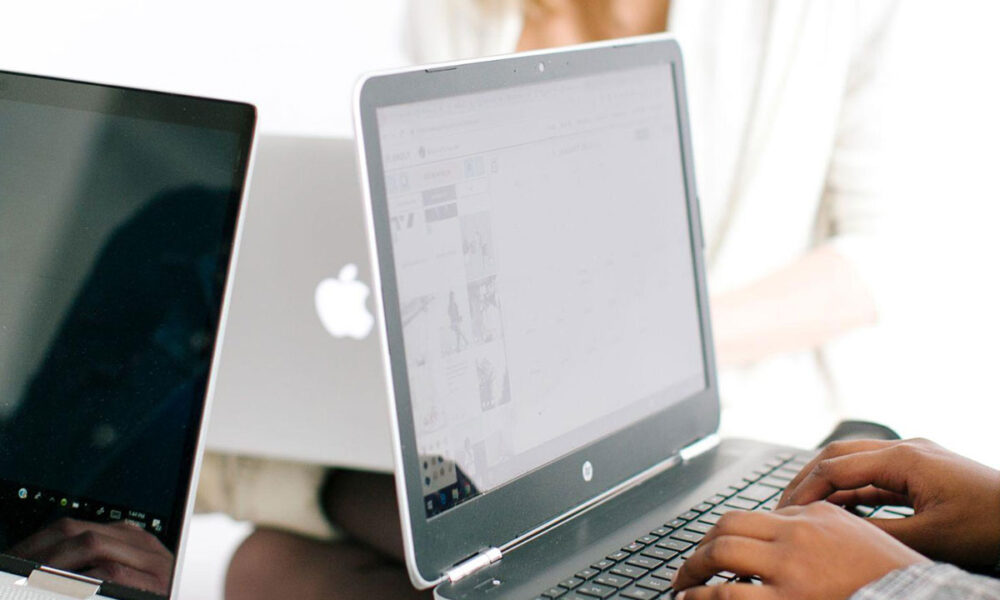 Women working in content marketing working on laptops