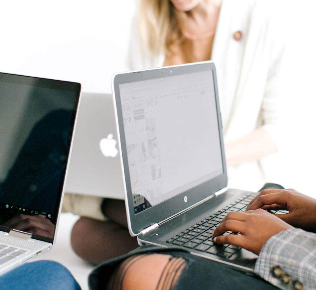 Women working in content marketing working on laptops